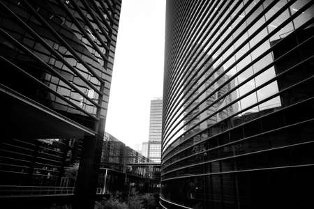 Skyscrapers against blue sky and cloudsの写真素材