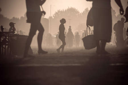 Lots of people in the dust travelingの写真素材
