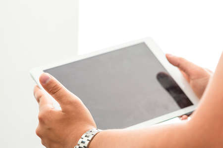 Tablet on hand close up