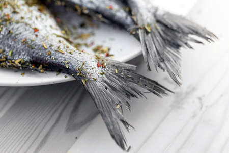 Fish on wooden background closeupの写真素材