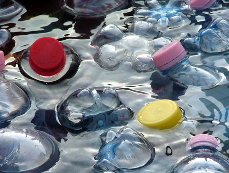 PET-bottles with soft drinks cooling in iced waterの写真素材