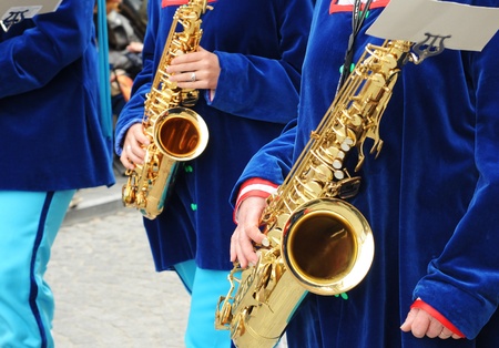 Musicians waiting to play the saxophone at the Procession of the Holy Blood 2010 in Bruges, Belgiumのeditorial素材