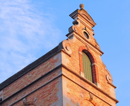 Old flemish decorated gable in the evening sun, bruges, flanders, belgium, europeの写真素材