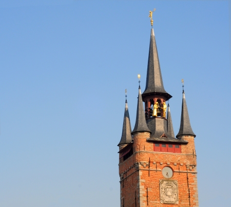 Antique belfry tower against blue sky in courtrai, flanders, belgium, europe の写真素材
