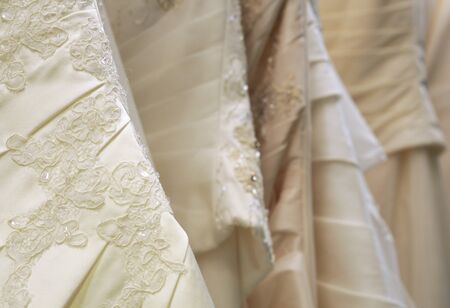 bridal gowns or wedding dresses in different shadesの写真素材
