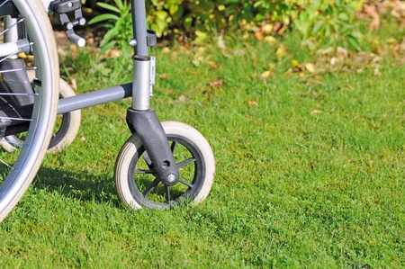 Detail of wheelchair in the grass, selective focusの写真素材