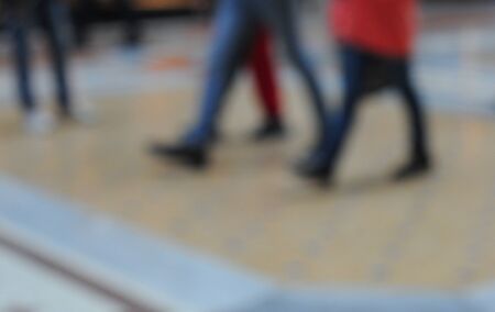Intentionally blurred picture of people walking in the galleria vittorio emanuele in milan,...