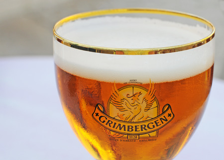 ORLEANS, FRANCE - JULY 4, 2015: The traditional Belgian blond abbey beer brand Grimbergen with the phenix logo is very popular in Orleans and other parts of Franceのeditorial素材