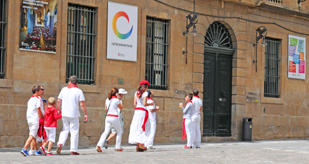 PAMPLONA, SPAIN - JULY 8, 2015: During the famous traditional annual feast of San Fermin, July 6 to 14, all inhabitants and most visitors are dressed in the city colours red and whiteのeditorial素材