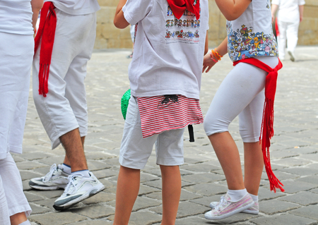 PAMPLONA, SPAIN - JULY 8, 2015: During the famous traditional annual feast of San Fermin, July 6 to 14, all inhabitants and most visitors are dressed in the city colours red and whiteのeditorial素材