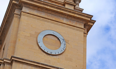 sundial on the gothic santa maria cathedral with neo-classistic gable  in pamplona, basque countryの写真素材