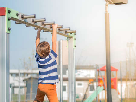 The boy is engaged in outdoor sports equipment.Activity sports