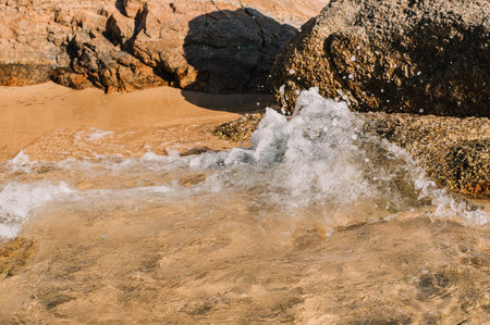 Deserted beaches with rocks and yellow sand.beautiful sea, waves.Sardinia
