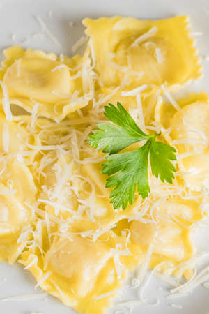 ravioli pasta on light plate. Italian food, top viewの写真素材