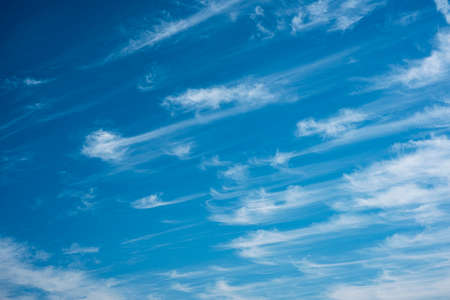White clouds in the blue sky background