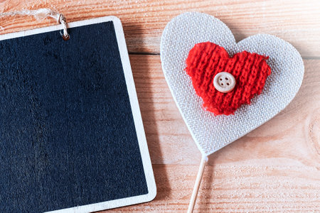 dark mock up and homemade heart on wooden table background. Top viewの写真素材