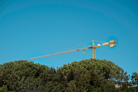 Construction and decoration of the building. Tower crane.の写真素材