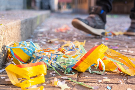 Colorful confetti and streamers at the street after Carnival showの写真素材