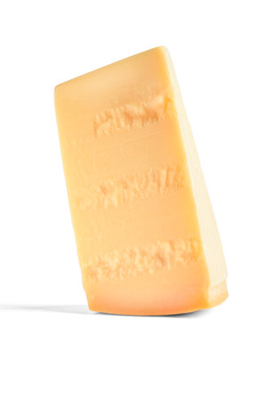 Piece of parmesan cheese isolated on white backgroundの写真素材