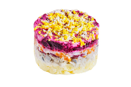 Layered salad with herring, beets, carrots, onions, potatoes and eggs isolated on whiteの写真素材