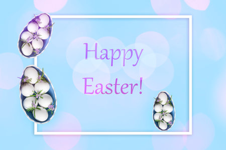 Composition with Easter eggs and green twigs rosemary on blue background