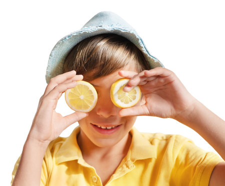 Boy with two halves of lemon as eyes and summer hat isolated on a white backgroundの写真素材
