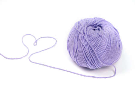 Woolen yarn isolated on white background in the form of a violet heart valentines dayの写真素材