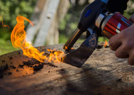 Removing old wooden paint from wooden furnitureの写真素材