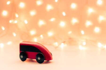 Cute red toy train on a lights background with place for textの写真素材