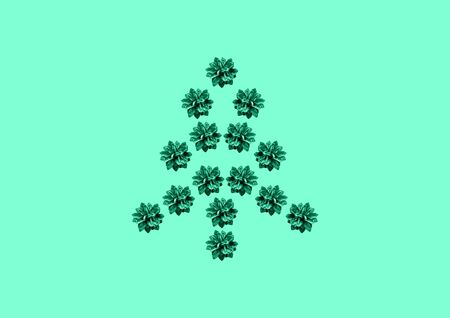Creative layout of Christmas tree made of fir cones on mint background. Nature New Year concept.の写真素材