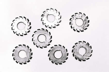 Several metal milling disc cutters for industrial equipment. The tool is isolated on a white...