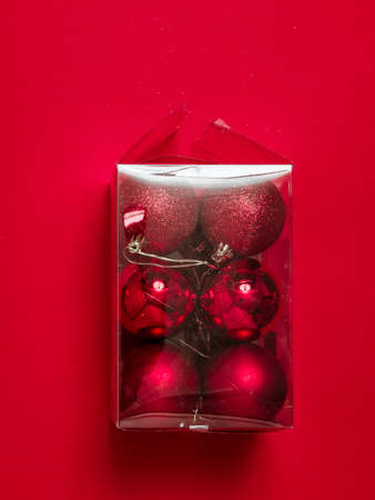 Rich Christmas tree balls are packed in a transparent plastic box. Preparing for the Christmas...