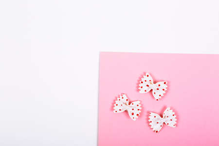 Step by step instruction how to make a Christmas tree decor. Macaroni in form of bow are painted...