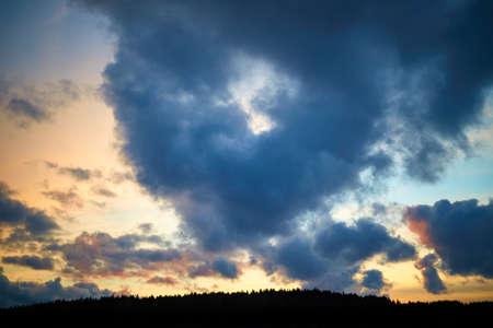 Cumulus cloud shaped heart on sky. Evening sunset. Symbol of love. Natural landscape. Cloudy...