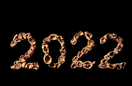 2022 new year. Numbers made from a pile of nutshells. Food style calendar. Wallpaper. Banner. Brown...