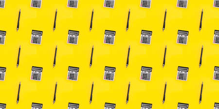 Seamless pattern with a large calculator and pen on yellow background. Financial banner. Mockup design texture. Business card. Copy space. Concept of accounting, profit, loss, tax. Digital stationeryの写真素材