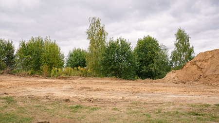 road construction. Sand mounds and leveled land. driveways. Creation of infrastructure. nature...