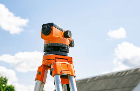 Surveyor equipment tacheometer or theodolite outdoors at construction site. copyspace. close-up....