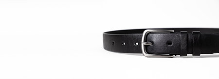Black leather belt for trousers and jeans. Fastened fashionable men's leather belt with dark chrome...