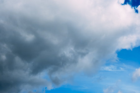 Blue sky with white cumulus clouds moving fast in day light. cloudscape. nature background. Windy weather forecast. religion concept. heaven landscape. fresh air. Morning inspiration. Daylight.の写真素材