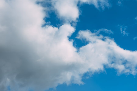 Blue sky with white cumulus clouds moving fast in day light. cloudscape. nature background. Windy weather forecast. religion concept. heaven landscape. fresh air. Morning inspiration. Daylight.の写真素材