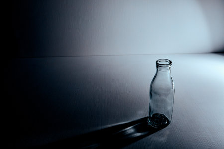 One red tulip lie on the table isolated on white background. copyspace. flower shop design. Empty place for text. holiday business card. memorial day. minimalist. Decoration. Sadness mood.の写真素材