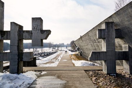 Khatyn, Belarus - March 13, 2021 State memorial complex. The burned villages. Victims of the Second World War. Symbol of the mass destruction of civilians by the Nazis. Visitors. Spring season. March.のeditorial素材