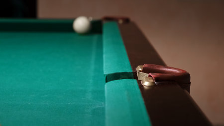 Russian billiards on a green table. The full middle pocket close-up. Copy space. Pastime at home...