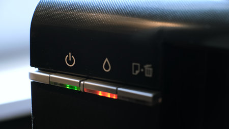 The green light on the printer is on and the red light is flashing, indicating a malfunction of the...