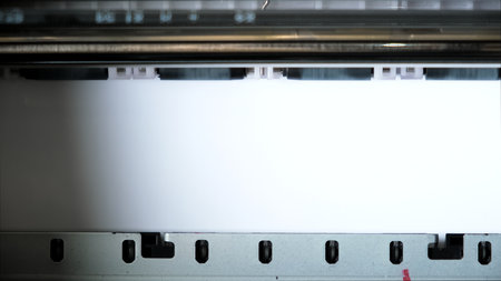 The clean paper sheet rolls in printer without paints. Printing process of color inkjet printer. The...
