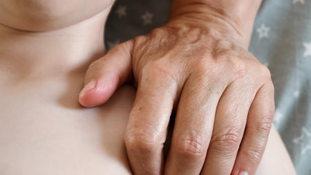 The masseur is massaging the shoulder of the child. A session of therapeutic lymphatic drainage massage. Physiotherapy treatment. An osteopath stretches tense muscles and relievesの写真素材