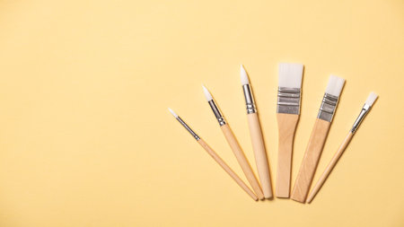 Collection of new paintbrushes of various sizes and styles for painting, crafting, art projects, and...