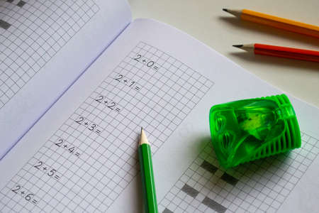 Back to school, learning to count and write numbers correctly, notebook and pencils