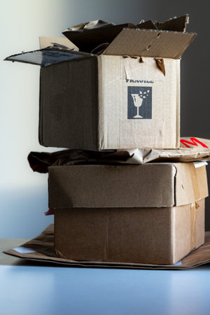 Opened cardboard bags and boxes from delivered parcelsの写真素材